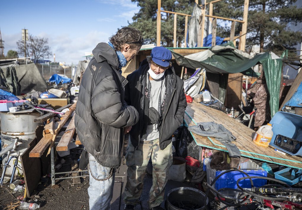  Both Thor Meyer, left, and Kenny Palazzo have been tested multiple times at their homeless encampment in Seattle. Only Palazzo tested positive. (Steve Ringman / The Seattle Times)